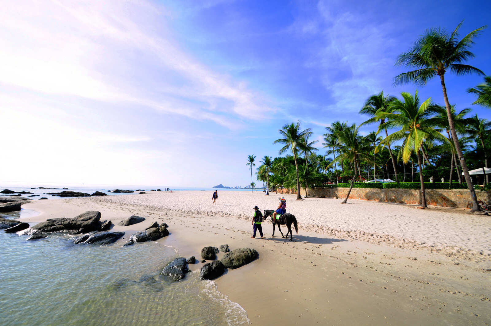 Horse riding on Hua Hin Beach is a popular summer activity 